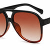 Stylish women's aviator sunglasses with gradient brown lenses and black frames, UV protection