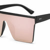 Stylish oversized sunglasses with gradient pink-green lenses and black frame, UV protection
