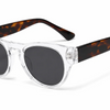 Clear frame sunglasses with tortoiseshell arms and dark lenses, stylish women's eyewear