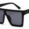 Black oversized square sunglasses with gray polarized lenses, stylish UV protection for women
