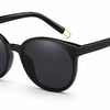 black ladies cat eye sunglasses with gold arm trim