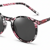 Stylish round sunglasses with pink and black marbled frames, polarized dark lenses for UV protection