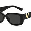 Small frame black sunglasses with gold detail