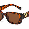 Sunglasses with tortoisehell frame and gold detail