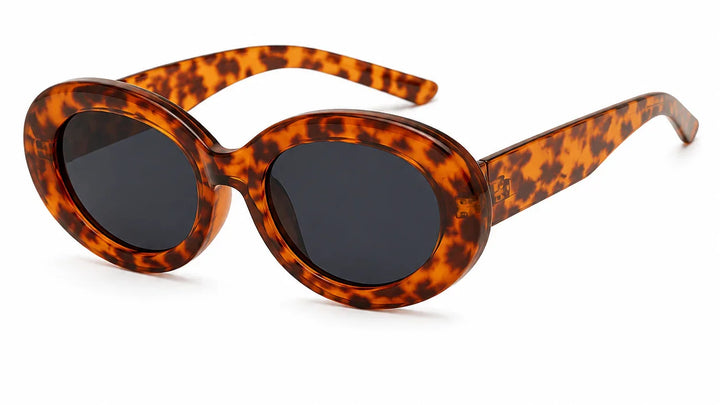 Tortoiseshell oval sunglasses with dark lenses, stylish women's UV-protected fashion shades