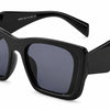 Jaimee Fashion Vintage sunglasses by Fox Shades with black oversized cat-eye frame and dark tinted lenses.