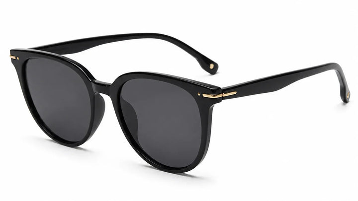 Black round sunglasses by Fox Shades with a glossy black frame, dark smoke lenses, slim black arms, and gold hinge accents.