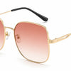 Gold frame women's sunglasses with pink gradient lenses, UV protection, stylish polarized design