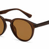 Brown round sunglasses by Fox Shades with a glossy frame, dark lenses, slim arms